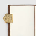 Traveler's Company - Traveler's Notebook - Brass Clip TRC Logo
